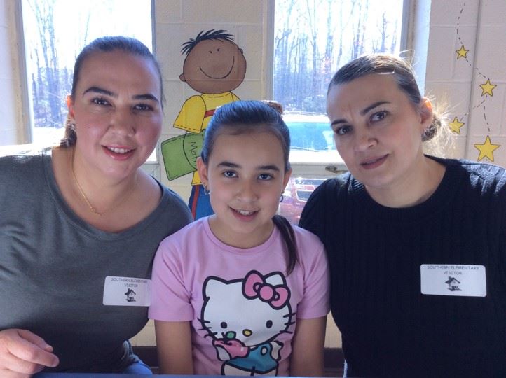 student and parent smiling